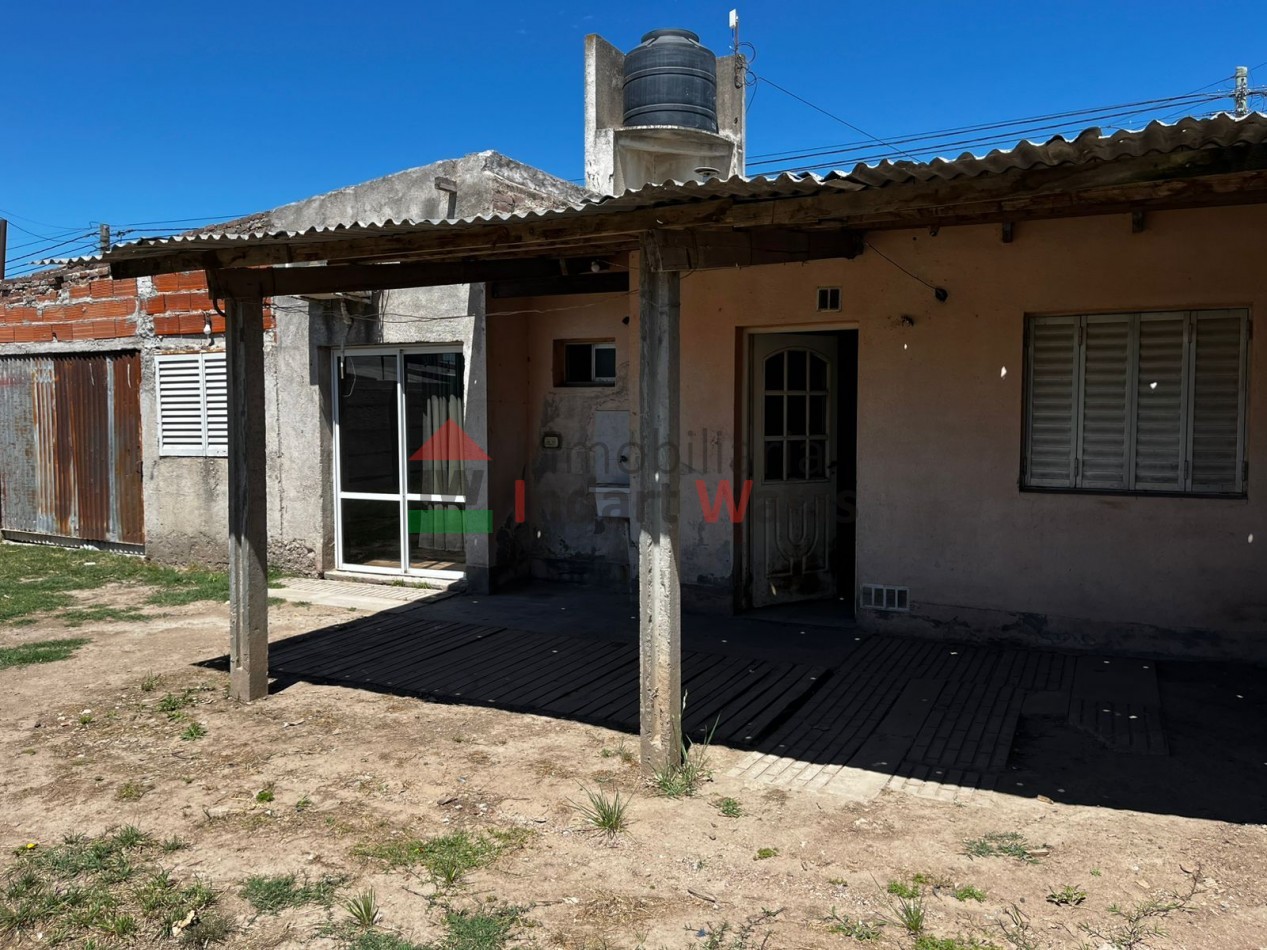 CASA DE BARRIO CON AMPLIACION. RETASADA!